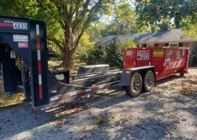 Knight Container Service dumpster parked on a residential driveway